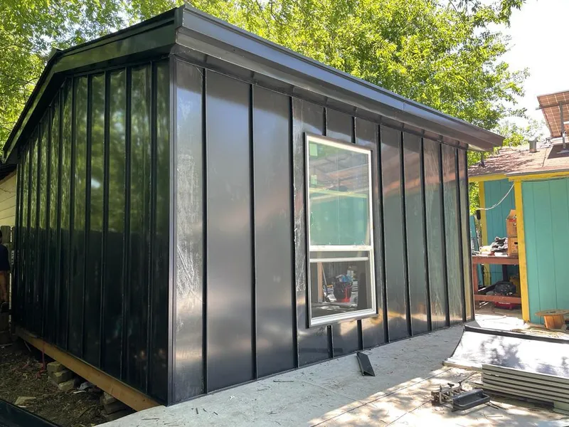 Black standing seam metal wall panels for Roof Inspection in Smithville