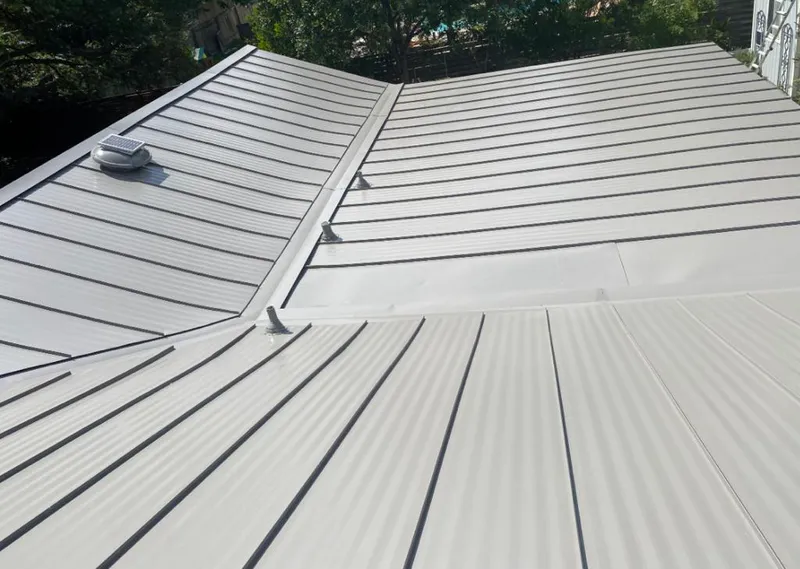 Solar attic fan installed on a metal roof for Roof Ventilation in Smithville